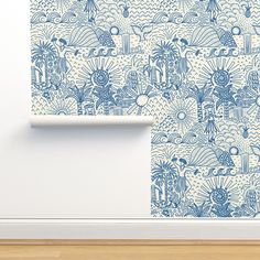 a blue and white wallpaper with an abstract pattern on it, in a room