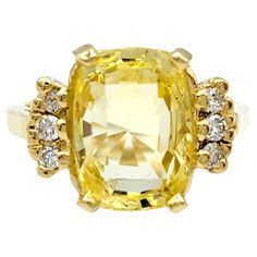 Ring Size: 5.25 Embrace the warmth and radiance of this cushion cut yellow sapphire ring, a true embodiment of elegance in polished yellow gold. The cushion-cut yellow sapphire, resplendent in its sunny hue, sits majestically as the centerpiece, radiating positivity and sophistication. Surrounding the vibrant sapphire are round white diamonds, delicately flanking the main stone on either side. Their brilliance adds a touch of timeless sparkle, creating a captivating contrast against the golden glow of the yellow sapphire. The polished yellow gold setting enhances the overall allure, providing a seamless backdrop that complements the rich tones of the gemstones. This ring is a celebration of both color and brilliance, a perfect harmony of the unique charm of the yellow sapphire and the clas Luxury Yellow Sapphire Women's Jewelry, Radiating Positivity, Turquoise Stone Ring, Yellow Sapphire Ring, Yellow Sapphire Rings, Smart Jewelry, Seamless Backdrop, Gold For Sale, Diamond Cocktail Ring