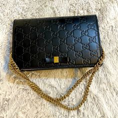 Black Gucci Logo Chain Bag Elegant Black Shoulder Bag With Gold-tone Logo, Luxury Black Wallet On Chain With Gold-tone Logo, Black Wallet On Chain With Gold-tone Logo For Evening, Black Wallet On Chain With Gold-tone Logo Plaque, Black Wallet On Chain With Gold-tone Logo, Designer Wallet On Chain With Gold-tone Hardware, Designer Wallet On Chain With Branded Hardware, Formal Black Wallet On Chain With Gold-tone Logo, Gucci Rectangular Shoulder Bag With Gold-tone Logo