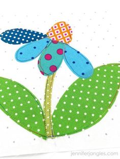 a green flower with polka dots on it