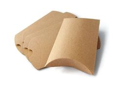 four pieces of brown paper sitting next to each other on a white surface with pink text that reads set 50 psc