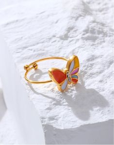 Creative Cute Colorful Enamel Mini Butterfly Rings - Stainless Steel 18K Gold Plated Waterproof Jewelry for Women & Girls Discover the charm of the Creative Cute Colorful Enamel Mini Butterfly Rings, designed to add a playful touch to any jewelry collection. Crafted from high-quality stainless steel and plated with 18K gold, these rings offer both durability and a luxurious finish. The vibrant enamel butterflies bring a burst of color, making these rings a delightful addition to your accessory w Yellow Enamel Ring, Yellow Enamel Round Jewelry, White Enamel Ring For Gift, Gold Enamel Ring Perfect For Gifting, Gold Enamel Ring For A Gift, Gold Enamel Ring Perfect For Gift, Multicolor Enamel Open Ring, Adjustable Multicolor Enamel Rings, Adjustable Multicolor Enamel Ring For Gift