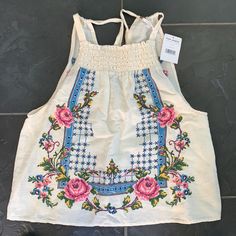 Free People Sleeveless Top With Embroidered Floral Design. New With Tags. Summer Embroidered Cotton Tank Top, Summer Cotton Embroidered Tank Top, White Embroidered Tank Top For Spring, Cream Floral Embroidered Summer Tops, Spring White Tank Top With Floral Embroidery, Floral Embroidered Tank Top For Spring, White Floral Embroidery Tank Top For Spring, Embroidered Tank Top For Summer, Spring Floral Embroidery Tank Top