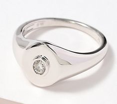 So modern, minimalist, and memorable, this signet ring is one you will happily wear everyday. Polished to perfection, its oval-cut diamond in the center is just the icing on the cake! From Accents by Affinity®. Classic Everyday Signet Ring With Single Diamond, Modern Diamond Signet Ring As Gift, Modern Diamond White Signet Ring As Gift, Modern White Gold Round Cut Signet Ring, Modern Signet Ring With Diamond Accents For Promise, Classic Diamond Signet Ring For Everyday, Modern Diamond Signet Ring For Promise, Modern Diamond Ring With Bezel Setting For Everyday, Classic Everyday Diamond Signet Ring