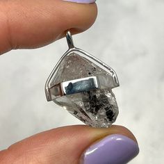 This unique Herkimer Diamond Healing Crystal Pendant is set in a 925 sterling silver girdle. Herkimer Diamonds are a double terminated form of quartz named after it's type locality, Herkimer County, New York, U.S.A.  Mineral Species - Quartz  Crystal System - Trigonal  Birthstone - Sagittarius  Chakra Alignment - Crown  Crystal Attributes:  Stimulates psychic gifts.  Brings in pure light and is used to clear the Chakras.  Considered to be an 'attunement' stone.  A powerful aid in attuning to ano Modern Polished Silver Gemstones, Nickel-free Spiritual Quartz Jewelry, Quartz Jewelry As A Gift, Quartz Jewelry Gift, Nickel-free Diamond-shaped Jewelry Gift, Nickel-free Diamond-shaped Jewelry For Gifts, Round Quartz Jewelry Gift, Gift Jewelry With Polished Diamond-shaped Finish, Adjustable Clear Pendant Jewelry