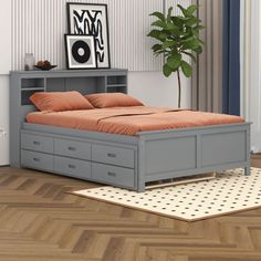 a bedroom with a bed, dresser and potted plant on the floor in front of it