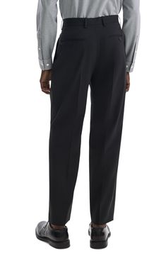 Crisp knife pleats emphasize the relaxed, roomy fit of dress pants that are tailored from soft wool and crafted with a touch of stretch to keep you moving comfortably. 32" inseam; 17 1/2" leg opening; 12 1/5" front rise; 16" back rise Zip fly with hook-and-bar closure Front slant pockets; back button-welt pockets Partially lined 97% virgin wool, 3% spandex Dry clean Imported Formal Bottoms With Relaxed Fit And Straight Hem, Relaxed Fit Wide Leg Business Dress Pants, Business Dress Pants Wide Leg Relaxed Fit, Modern Relaxed Fit Bottoms For Formal Occasions, Relaxed Fit Wide Leg Dress Pants For Business, Wide Leg Dress Pants For Business With Relaxed Fit, Business Dress Pants With Relaxed Fit And Straight Hem, Business Dress Pants With Relaxed Fit, Relaxed Fit Dress Pants With Straight Hem For Business