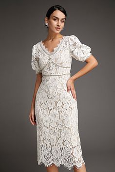 This lace crochet V-neckline midi dress will fill any of your little white dress needs, from your bridal shower to your after party. The textured lace overlay, accented with thick embroidery that outlines the lace’s blooms. Also features puff sleeves and delicate scalloped eyelash lace hem. The rhinestone trim and buttons adds an extra glitz and glam. No Stretch Medium Weight Size runs small,recommend one size up Fabric: 100% Polyester,Lining: 100% Polyester Model is 174cm/5'7" tall, 81cm/32" bust, 61cm/24" waist and 90cm/35" hip and wears a size S. Care Instruction: Hand Wash, Do not bleach, Dry flat in shade, Iron cool (max 110â„?, Dry clean, tetrachloroethylene(PCE) only.Please note: The images represent actual product though color of the image and product may slightly differ. This item Wedding Guest Dresses Formal, Midi Dress Wedding, Thick Embroidery, Modest Midi Dress, Vintage Dress Design, Midi Wedding Dress, Dresses Wedding Guest, Wedding Guest Dresses, Cap Dress