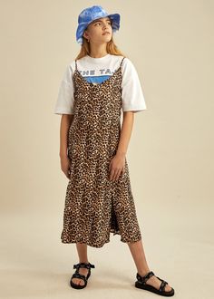 One of our favorites this season: A beautiful strappy v-neck dress with side-slits in leopard print, made in a tencel twill quality. Can be worn over a t-shirt for an edgy look. 100% Tencel Casual Leopard Print Summer Dress, Chic Tiger Print Summer Dress, Chic Summer Tiger Print Dress, Chic Summer Dress With Tiger Print, Casual Midi Leopard Print Dresses, Casual Leopard Print Spring Dress, Casual Leopard Print Dress For Spring, Casual Midi Length Slip Dress, Trendy Summer Dress With Side Slits