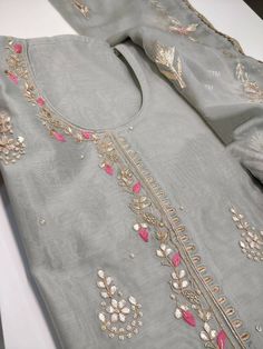 Item Overview ATHARVA Hand Embroidery Salwar Kameez/Grey/Chanderi Silk/Gota Pati Chiffon Chinon Dupatta/Custom Stitch Unstitch/Churridar/Anarkali/Gift/ Dno. CH1804 Fabric: * Shirt - Chanderi Silk- Hand Embroidered Neck 2.5 Mts - Beautiful Hand Embroidery * Dupatta: Chiffon Chinnon Dupatta- All over Exclusive Gota Patti Embroidery - 2.5 Mts- Latkans Tassels * Bottom Santoon Silk 2.5 Mts. Excusive Hand Embroidered Party Wear Punjabi Suit. Customization: * Fabrics Customization: Designs Can be made Embroidery On Grey Fabric, Semi-stitched Gray Traditional Wear With Zari Work, Gray Anarkali Set With Dupatta, Traditional Gray Festive Sets, Gray Traditional Festive Sets, Festive Gray Diwali Outfit Sets, Gray Festive Sets For Diwali, Festive Gray Sets For Eid, Traditional Gray Chikankari Embroidery Sets