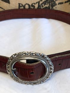 vintage beautiful leather belt by Brighton two tone Cocoa brown and black leather reversible silver belt buckle and silver accents tagged Brighton measures in very good preowned condition shows minimal wear Classic Brown Belt Buckles With Silver Buckle, Formal Brown Belt Buckles With Silver Buckle, Brown Belt With Silver Buckle For Formal Occasions, Formal Brown Belt With Silver Buckle, Elegant Brown Belt With Silver Buckle, Silver Belt With Buckle Closure For Formal Occasions, Vintage Brown Belt Buckles With Silver Buckle, Vintage Formal Belts With Silver Buckle, Elegant Brown Belt With Concho