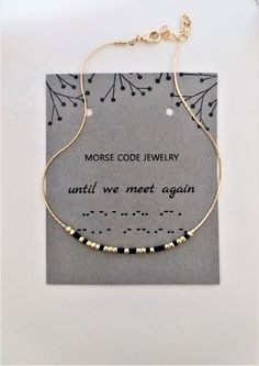 the morse code jewelry bracelet is on display in front of a card that says, until we meet again