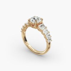 a yellow gold engagement ring with three stones on the side and an oval diamond center