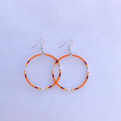 These beautiful hoop earrings come in different colors. They are made out of seed beads. If there is a color sold out just message us as we may have more or if you have any other questions. Thanks for looking at our page. We also have some clearance items or raffles on are Facebook group pages. Come check us out at Cassy's Native Selling & Auctions or Cassy's Native Beadwork & Apparels. Orange Beaded Hoop Earrings As A Gift, Orange Beaded Hoop Earrings For Gift, Orange Hoop Earrings With Colorful Beads, Orange Hoop Beaded Earrings As Gift, Nickel-free Orange Hoop Earrings, Orange Beaded Hoop Earrings, Orange Hoop Earrings With Colorful Beads For Gift, Orange Small Hoop Earrings With Ear Wire, Handmade Orange Hoop Earrings