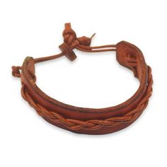 This simple but attractive bracelet for men is crafted by Gill Quarcoopome in Ghana. The artisan crafts the wristband from warm tan leather accented by a braided cord of leather in a slightly lighter shade. The casual bracelet is secured with a leather button clasp. Adjustable Brown Braided Bracelet For Everyday Use, Adjustable Vintage Bracelets, Adjustable Brown Bracelet, Classic Handmade Adjustable Braided Bracelets, Adjustable Brown Bracelets For Everyday Use, Handmade Classic Braided Bracelets, Classic Adjustable Handmade Braided Bracelets, Brown Braided Bracelets For Everyday, Everyday Brown Braided Bracelets