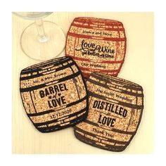 three cork coasters that say barrel love and have wine glasses next to each other