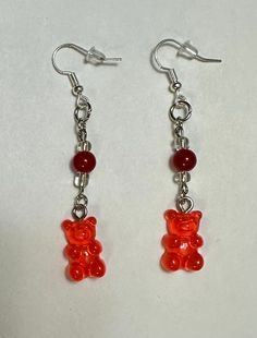 Gummy Bear Earrings Gummy Bears are plastic, the other 3 beads are glass. The metal fixings are made of iron. Red Plastic Earrings For Gift, Red Resin Novelty Earrings, Fun Red Resin Earrings, Fun Style Red Resin Earrings, Red Resin Novelty Jewelry, Novelty Red Resin Jewelry, Handmade Red Plastic Earrings, Fun Red Resin Jewelry, Red Novelty Plastic Jewelry