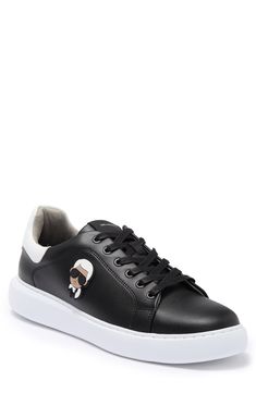 An Iconic Karl Lagerfeld image details the sides of these crisp white sneakers for casual days. Round toe Lace-up vamp Padded collar White sole Leather and synthetic upper, synthetic sole Imported Black Casual Sneakers With Logo-print Tongue, Casual Streetwear Sneakers With Logo-print Tongue, Casual Lace-up Logo Sneakers, Black Synthetic Sneakers With Logo, Trendy Sneakers With Logo And White Sole, Trendy Black Sneakers With Logo, Trendy Black Sneakers With Logo Print, Penny Loafers Men, White Shoes Men