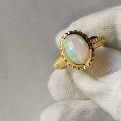 Material  14k Yellow Gold  . Gemstone  Natural Opal . Gemstone Colour  White  . Gemstone Shape  Oval . Gemstone Size  6x8 MM . birthstone  October  . Cut Grade  Excellent . Style  Art Deco Anniversary Opal Ring Stamped 14k In Oval Shape, Oval Gold Opal Ring In 14k Gold, Heirloom Oval Opal Ring For Formal Occasions, Fine Jewelry Cabochon Gemstones For Wedding, Classic Oval Opal Jewelry, Oval Gemstone Jewelry In 14k Gold, Luxury Oval Opal Ring For Anniversary, Oval Opal Ring In Yellow Gold Stamped 14k, Luxury Oval Diamond Cut Gemstones