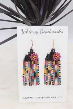 Add a pop of color to your outfit with these handcrafted beaded seed bead earrings! Measuring just over 2 inches long, these unique earrings feature bright colors perfect for adding a playful touch to any look. The floral accent adds a touch of whimsy, and the fringe detail adds a fun and trendy flair. Stand out from the crowd with these vibrant and stylish earrings that are sure to make a statement wherever you go.Lightweight and comfortable to wear. Each tiny bead is sewn into place one at a time with a needle and strong beading thread creating a piece of wearable art.✔️handmade in the USA✔️lightweight & comfortable ✔️golden brass ear wires (we also offer the option of gold filled or niobium ear wires if needed-just message us)✔️2 3/8 inches long ✔️3/4 inch wide✔️ships boxed and ready to Summer Salsa, Beading Thread, Ivory Earrings, Stylish Earrings, The Fringe, Stylish Earring, Seed Bead Bracelets, Seed Bead Earrings, Art Handmade