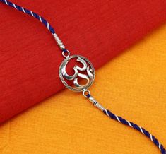 his is fabulous free size OM Bracelet, We can use either as Bracelet of Rakhi bracelet.925 sterling silver customized super Rakhi bracelet, best gift for your brother's, Amazing OM Design rakhi bracelet.Metal-925 sterling silver.Item type-Rakhi Bracelet.Weight-5.090 grams.Size-Free size.Stamped-925 hallmarked.Best RakhshaBandhan gift for your brothers. Adjustable Silver Bracelets For Diwali, Round Bracelets Gift For Diwali, Diwali Gift Bracelets, Adjustable Sterling Silver Bracelets For Diwali, Adjustable Fusion Style Sterling Silver Bracelet For Gift, Symbolic Sterling Silver Bracelets For Festivals, Spiritual Sterling Silver Bracelet For Festivals, Festival Gift Bracelets With Hallmark, Sterling Silver Bracelet As Festival Gift