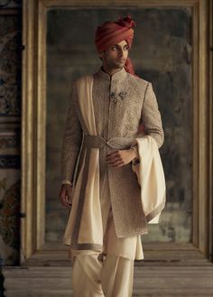 Step into sophistication with this mocha raw silk sherwani, featuring dori and resham French knot embroidery, enhanced with dabka, beads, and crystals. Paired with a cotton silk kurta and churidar, it comes with a worked belt and stole Designer Ceremonial Raw Silk Sherwani, Traditional Embroidered Slub Silk Sherwani, Designer Embroidered Slub Silk Sherwani, Semi-stitched Raw Silk Sherwani With Embroidery, Semi-stitched Raw Silk Sherwani With Intricate Embroidery, Haldi Outfit, Sherwani Groom, French Knot Embroidery, Wedding Sherwani