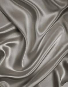 an image of a satin fabric textured in grey color for background or wallpaper