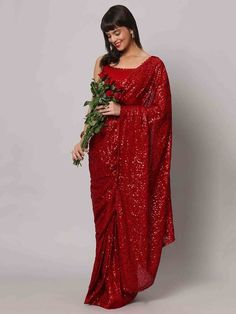 Wear this stunning red sequins georgette cocktail party wear a saree with a blouse and make heads turn at any event. Designed with intricate sequin work and a beautiful sequin floral border, this saree is made from high-quality georgette material that ensures comfort and elegance. The heavy sequin work on both the saree and blouse adds a touch of glamour to your outfit, making it perfect for parties and receptions.
This designer saree comes in a vibrant red color that exudes grace and sophistica Festive Pre-draped Saree With Zari Work For Party, Glamorous Festive Pre-draped Saree For Celebration, Bollywood Style Festive Pre-draped Saree With Sequins, Pre-draped Saree With Dupatta For Navratri Party, Glamorous Sequined Pre-draped Saree For Festivals, Bollywood Style Floor-length Pre-draped Saree For Parties, Party Wear Pre-draped Sequined Saree For Festivals, Sequin Chinon Pre-draped Saree For Diwali, Party Pre-draped Chinon Saree With Mirror Work