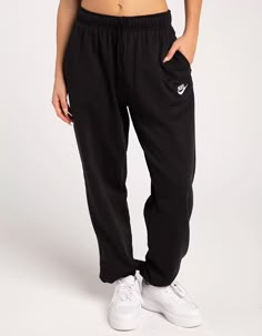 NIKE Sportswear Club Womens Oversized Fleece Sweatpants - BLACK | Tillys Nike Cuffed Sweatpants Women, Black Nike Sweatpants Outfits Women, Nike Sweat Pants Outfit Women, Black Sweatpants Women, Black Nike Joggers Outfit, Black Nike Sweatpants Outfits, Nike Sweats Women, Nike Sweatpants Girls, Nike Sweatpants Women