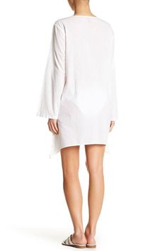 Casual yet chic, this cover up dress is the perfect mate for your bikini. Embellished with beautiful embroidery , the throw on and ready to go style is comfortable and easy to wear. This tunic-style v-neck dress is a must have from the house of La Moda. • Dress, Cover Up • Beachwear, Resort Wear • 100% Rayon • Goga Swimwear • Available in White • Size: S/M, L/XL • Washing Instruction: Hand Wash with Cold Water, Tumble Dry, Do not Iron Spring V-neck Beach Dress, Chic Tunic Cover-up For Beach Season, Beachy White V-neck Cover-up, Chic V-neck Festival Cover-up, Summer V-neck Tunic For Loungewear, V-neck Kaftan For Resort Season, Unlined V-neck Cover-up For Vacation, Cotton Beach Party Cover-up, Cotton Beach Cover-up For Vacation