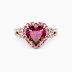 a heart shaped ring with pink and white diamonds