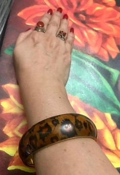 "BIG, BOLD & TIMELESS PRINT! Vintage lucite and tiger print bangle with 3/4\" inch width! Bracelet is in very good condition. Purchased this item at an estate sale, Circa 1960s! Please review all pictures. Note: shiny so reflects room decor. Any questions, don't be shy. THANK YOU for visiting my Etsy shop. I have excellent reviews on here and other platforms. I am considered a recommended and fair seller! Mexicana / Taxco / Mexico / Sterling / Silver / Stampd / Native / Authentic Original Vintag Vintage Stretch Bangle Bracelet, Adjustable Brown Vintage Bangle, Lucite Bracelets, Vintage Bangle Bracelets, Rose Shop, Sterling Silver Bangle Bracelets, Silver Bead Necklace, Vintage Lucite, Silver Bangle Bracelets