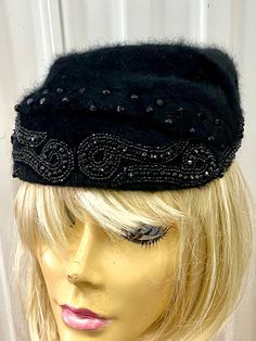 A BLACK SOFT FUR HAT WITH GREAT LOOKING RHINESTONE AND BEAD PATTERN ON THE FRONT - MADE BY VOGUE HATS NEW YORK.I AM NOT SURE OF THE FUR BUT THINK IT IS RABBIT.NO SIZE LABEL BUT SHOULD FIT MOST HEADS. Black Cloche Hat For Winter Party, Black Winter Cloche Hat For Party, Black Winter Party Cloche Hat, Black Cloche Hat For Evening In Winter, Black Winter Cloche Hat For Evenings, Black Hat With Rhinestones For Evening, Adjustable Mini Hats For Winter Evenings, Black Winter Evening Cloche Hat, Black Evening Hat With Rhinestones