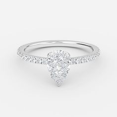 a white gold engagement ring with a pear shaped diamond