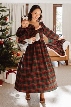 * NOTE: We recommend sizing down 1 size in this dress The Margo Midi Dress offers timeless holiday style. Constructed from a classic red and green plaid print, this dress features a smocked panel in the back and a large beautiful bow in front. Finished with a hidden back zipper and long sleeves, you will look and feel Dark Green Christmas Dress, Mom And Daughter Christmas Dresses, Plaid Christmas Dresses, Cottage Core Christmas Outfit, Modest Christmas Dresses, Womens Winter Dress, Christmas Church Outfit, Holiday Dresses Christmas, Christmas Dress Long