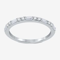 a white gold wedding band with baguettes on the side and diamonds in the middle