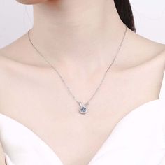 Feel the sparkle of the 925 Silver Moissanite on our Cute Bunny Necklace. The stone is cut to perfection and designed to reflect the light for a captivating glimmer. An exquisite piece of jewelry with a unique design. Product Details: Material: 925 Sterling Silver Stone: Moissanite Diamonds/D /1 carat Weight: about 2.13g Length: 45cm Pendant Diamond Height: 6.5mm SKU: AN23102328 Keywords: moissanite chain, moissanite necklace, moissanite pendant, moissanite pendants, moissanite diamond chain, pe Silver Solitaire Necklace Fine Jewelry, Minimalist Sterling Silver Jewelry With Sparkling Stones, Silver Solitaire Gemstone Necklace, Round Cubic Zirconia Solitaire Necklace With Gemstone, Silver Necklace With Diamond Cut, Round Solitaire Necklace With Cubic Zirconia, Silver Necklace With Diamond Cut Round Shape, Silver Necklace With Diamond Cut Round Stone, Round Solitaire Necklace With Cubic Zirconia Gemstone