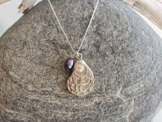 Small silver plated oyster shell pendant. The shell hangs from a sterling silver chain with a sterling silver clasp. Can be made with either a white pearl or a colorful peacock pearl. Shown here in 18 inch length. Also available in gold and found here:https://www.etsy.com/listing/460909492/small-shell-necklace-oyster-shell-pearl?ga_search_query=Oyster&ref=shop_items_search_2&frs=1&crt=1 *If you are unsure of the length you need, or would like to wear this item at different lengths, w Silver Shell Necklaces With Pearl Charm, Silver Shell Necklace With Pearl Pendant As Gift, Silver Shell-shaped Necklace With Pearl Pendant, Seashell Art Diy, Colorful Peacock, Peacock Pearl, Sea Jewelry, Gemstone Beads Jewelry, Seashell Jewelry