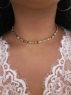 "Rainbow Bead Choker - Stretch Bead Choker - Rainbow Beaded Choker - Seed Bead Choker - Boho Bead Choker - Dainty Beaded Choker - Seed Choker - Elastic Choker - Stretchy Choker - Rainbow Beaded Necklace - Beach Choker * D E T A I L S * This choker is made with size 8 Seed Beads and is finished with a Silver Lobster Clasp and also comes with a 2 inch extender chain.  * S I Z E * This choker is avaliable in the following sizes: 11 inches 11.5 inches  12 inches  12.5 inches 13 inches  13.5 inches Colorful Letter Beads For Festival, Colorful Heishi Letter Beads, Festival Multicolor Letter Beads, Colorful Heishi Beads For Festival, Bohemian Letter Beads For Jewelry Making, Bohemian Letter Beads For Crafting, Rainbow Beaded Necklace, Miyuki Bead, Seed Bead Choker