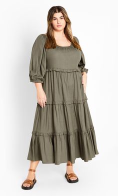 Bring your inner boho chic game, in the Heather Tier Dress. Presenting this casual relaxed fit, pull over style with a round neckline & an elongating tiered skirt, perfect for the comfort versatile styling. Key Features Include: - Round neckline - Elbow sleeves with elastic cuff - Pull over style - Tiered frilled detail - Midi hemline Pair with a denim jacket and sneakers for shopping with friends. | Plus Size Dress Heather Tier 26 in Olive, Size 22/XL | City Chic Casual Tiered Maternity Dress For Spring, Bohemian Midi-length Tiered Dress For Brunch, Spring Maternity Tiered Maxi Dress, Casual Tiered Maternity Dress, Green V-neck Spring Tiered Dress, Shopping With Friends, Prairie Dresses, Tier Dress, Olive Dress