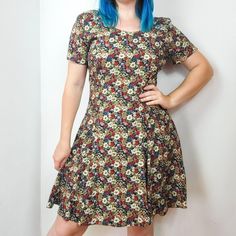 Vintage 90s floral print mini dress from Rampage. Slip on style with tie corset back. Super lightweight. Tagged size 7 best fit size S/M. Keep in mind this is slip on style and does not have any stretch. Better to size down for a more comfortable fit. Model is 5'3 size S/M (28in waist). Mannequin measures B 35.5 / W 27 / H 36. Please see measurements for details.  PM me if you have any questions.   MEASUREMENTS: (taken laying flat) CHEST  - 19in  WAIST  - 17in  LENGTH  - 35in  Please note, all items listed in my shop are considered vintage (20+ years old). These items have been previously loved and therefore will have normal amounts of wear and tear. Any major flaws will be noted in the item description and photographed. Please contact me directly with any questions you may have before pur Fitted Floral Mini Dress, Fitted Floral Print Mini Dress, Fitted A-line Dress With Ditsy Floral Print, Fitted Floral Print Mini Dress With Short Sleeves, Floral Print Stretch Mini Dress, Fitted Floral Print A-line Mini Dress, Fitted Ditsy Floral Print Mini Dress, Fitted Knee-length Ditsy Floral Dress, Fitted Knee-length Ditsy Floral Print Dress