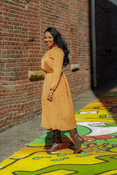 Pleated Camel Dress This pleated camel dress is a must have! Perfect for brunch, work or even a night out. You can pair with your favorite boots or sandals depending the season. This dress is a great transitional piece. Details: Gathered neck and wrists Long sleeves Comes w/ belt Comfortable Model is wearing a size small Fits true to size for most Model Measurements: Size: Medium • Height: 5'6 • Bust: 34 • Waist: 30 • Hips: 41.5 • Fall Pleated Solid Midi Dress, Pleated Midi Dress For Fall, Fall Midi Dress For Brunch, Knee-length, Chic Orange Pleated Midi Dress, Fall Brunch Midi Dress Knee-length, Fall Brunch Knee-length Midi Dress, Fall Midi Dress For Brunch, Casual Pleated Midi Dress For Fall, Fall Brunch Mid-length Midi Dress