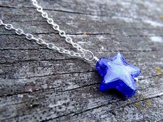 "Offered for moms who have sons or daughters in the military is our BLUE STAR MOM necklace! This was my beloved Dad's idea who retired as Command Sergeant Major from the US Army, and passed 9 months ago. I never would have known about Blue Star moms if not for him. The blue star is hand made by glass artists in Venice, Italy (Murano glass / Venetian glass), and it's small (1/2\" across). Please refer to the fourth photo to get a sense of size. Using the drop down menu, you may add an initial cha Blue Star Shaped Necklace For Gift, Blue Star Charm Necklace For Gift, Blue Star Charm Necklace As Gift, Blue Star Charm Necklace As A Gift, Blue Star-shaped Nickel-free Necklace, Blue Necklace With Star Charm As A Gift, Blue Star Charm Jewelry As Gift, Blue Star Charm Jewelry For Gift, Blue Jewelry With Star Charm For Gifts