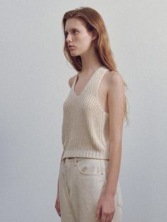 This is a minimal and modern top by NOTHING WRITTEN that is made out of high quality and sturdy material. With distinctive mood of the design and comfortable wear, you can style it for your casual daily outfit.- Deep V neckline- Deep armhole line and high elasticity- Feminine and modern mood Modern V-neck Top For Spring, Versatile Beige V-neck Top, Knit V-neck Crop Top For Day Out, Summer V-neck Crop Top For Layering, Chic V-neck Crochet Top For Fall, Beige Cotton V-neck Knit Top, Modern V-neck Tops For Summer, Sleeveless Knit Tops With Relaxed Fit, Summer V-neck Crochet Top For Layering