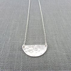 "Silver Half Moon Necklace | Hammered Half Circle Necklace | Sterling Silver Festoon Pendant | Handcrafted Geometric 925 Jewelry My silver half moon necklace features a hand hammered half circle festoon style pendant on a silver cable chain. All materials are .925 US-procured sterling silver. The hammered half circle is attached directly to the chain and is measured as part of the total length of the chain. I have 3 options for lengths available to select at checkout. The model is wearing an 18\ Adjustable Moon Shaped Sterling Silver Necklace, Adjustable Moon-shaped Sterling Silver Necklace, Silver Half Moon Necklaces For Jewelry Making, Silver Half Moon Necklace For Jewelry Making, Minimalist Handmade Moon Necklaces, Everyday Handmade Half Moon Jewelry, Adjustable Silver Half Moon Necklace, Nickel Free Half Moon Silver Necklace, Adjustable Half Moon Silver Necklace