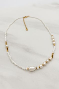 Transform your everyday look into a romantic one with our Dainty Pearl Necklace. The elegant and delicate design of this necklace will add a touch of sophistication to any outfit. Elevate your style and embrace the beauty of life with this must-have accessory. Imported Length 45cm Titanium Steel, Freshwater Pearls Elegant Everyday Beaded Pearl Necklace, Delicate Pearl White Necklace With Clavicle Chain, Feminine White Jewelry With Clavicle Chain, White Clavicle Chain Pearl Necklace For Everyday, Feminine White Clavicle Chain Jewelry, Delicate Beaded Necklace With Pearl Pendant As Gift, Feminine Pearl Beaded Necklace As Gift, White Beaded Necklaces With Delicate Chain For Wedding, White Pearl Necklace With Clavicle Chain As Gift