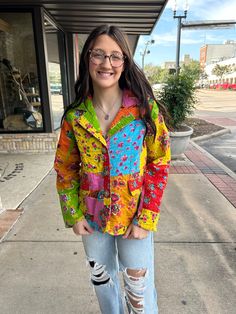 Add a pop of color to your wardrobe with our Kantha Stich Patchwork Blazer! This quirky blazer features a vibrant floral patchwork design, faux pockets, and button closure. Its quilted construction provides both style and warmth. A playful and unique addition to any outfit! Casual Multicolor Outerwear With Floral Patchwork, Casual Multicolor Blazer With Pockets, Spring Multicolor Outerwear With Patch Pockets, Multicolor Quilted Spring Outerwear, Spring Multicolor Cotton Blazer, Multicolor Cotton Outerwear With Floral Print, Spring Multicolor Floral Patchwork Outerwear, Fall Multicolor Floral Patchwork Outerwear, Multicolor Cotton Blazer For Fall