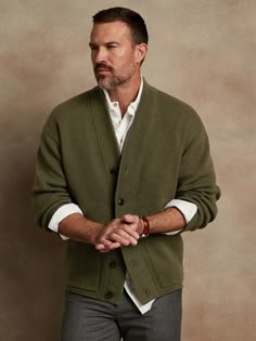 Made from a blend of extra fine Merino wool, this soft and warm cardigan is knitted in a subtly textured half-Milano stitch, which adds soft structure for refined appeal.  OVERSIZED FIT: Relaxed, boxy fit with a dropped shoulder.  Standard fit.  Long Mens Oversized Cardigan, Cardigan Sweater Men, Cardigan Sweater Outfit Men, Cozy Wool V-neck Sweater For Work, Classic V-neck Soft Knit Outerwear, Classic V-neck Sweater Coat For Layering, Textured Knit V-neck Outerwear, Classic Soft Knit V-neck Sweater For Work, Elegant Soft Knit Solid Color Cardigan