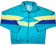 Retro Blue Long-sleeve Windbreaker, Retro Blue Long Sleeve Windbreaker, Blue Retro Windbreaker For Streetwear, Retro Blue Windbreaker For Streetwear, Blue Fitted Sporty Windbreaker, Retro Spring Windbreaker For Outdoor, Vintage Blue Long Sleeve Windbreaker, Blue Retro Track Jacket For Spring, Retro Track Jacket For Spring Streetwear