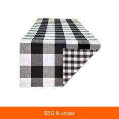 a black and white checkered tablecloth with the words $ 50 & under on it